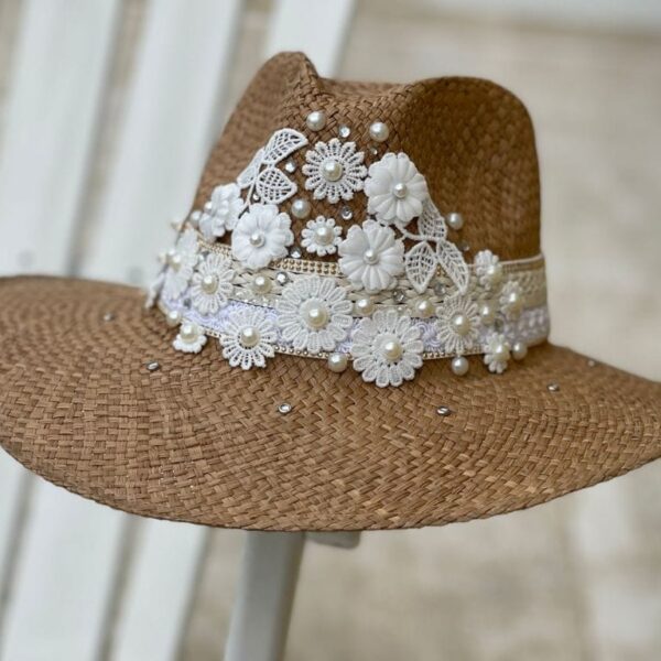 a hat with lace and pearls
